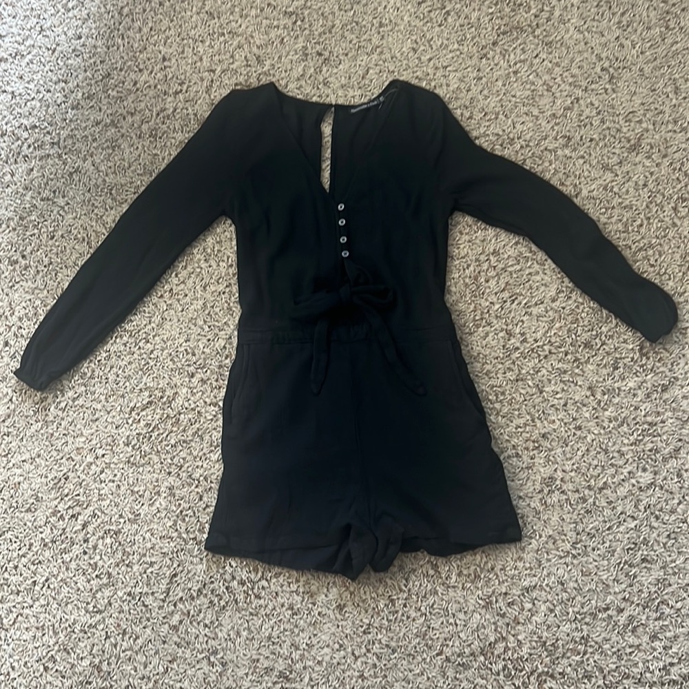 Super cute black romper. Has pockets